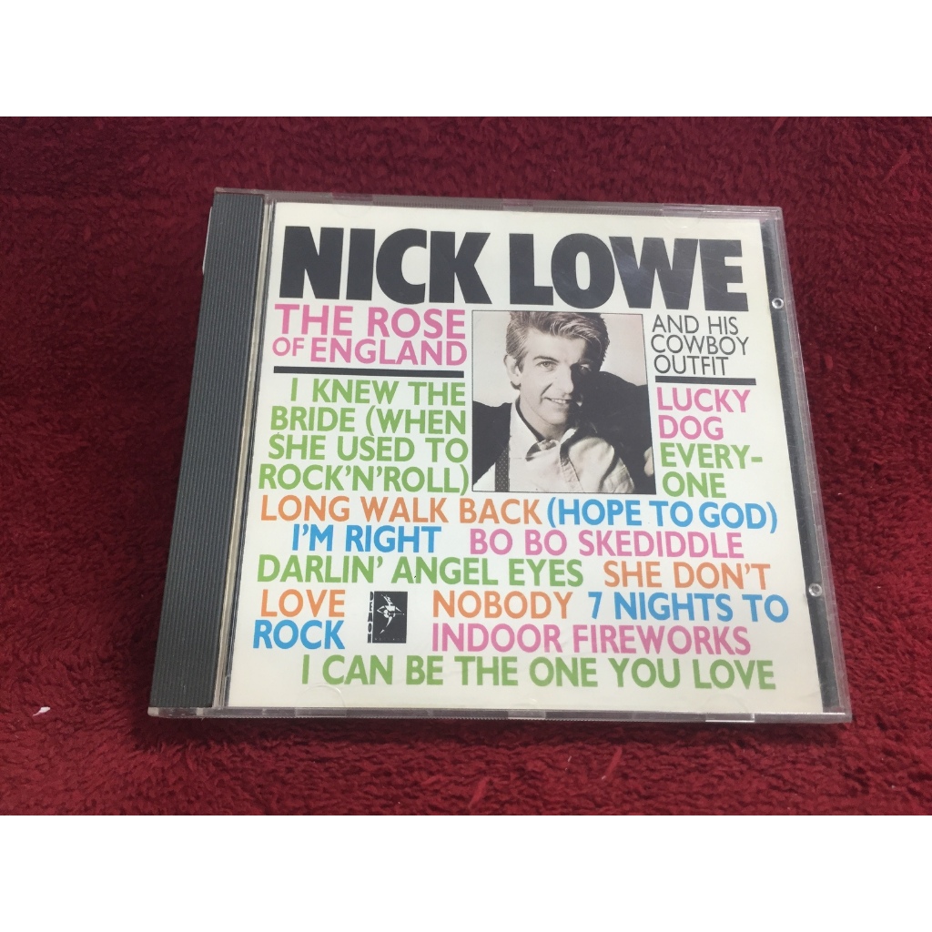 CD Nick Lowe And His Cowboy Outfit – The Rose Of England สภาพตามปก CA27-104