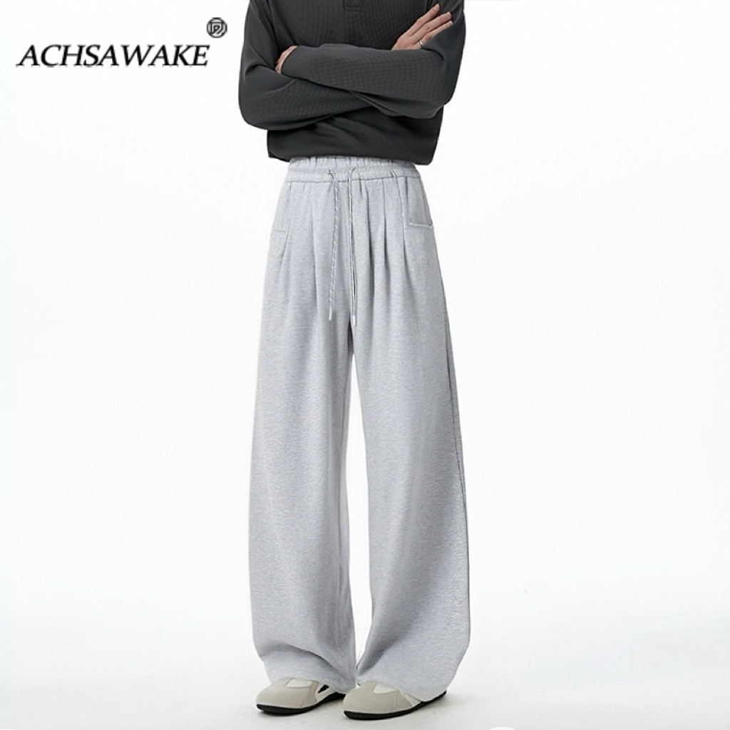 ACHSAWAKE กางเกงสปอร์ตขากว้างผู้ชาย เอวยืดสวมสบาย เนื้อผ้าพลิ้วตกแต่งตัว ทรงหลวมช่วยให้ดูเพรียวบาง