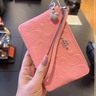 กระเป๋าคล้องมือ รุ่น Corner Zip Wristlet In Signature Canvas มีสีให้เลือก