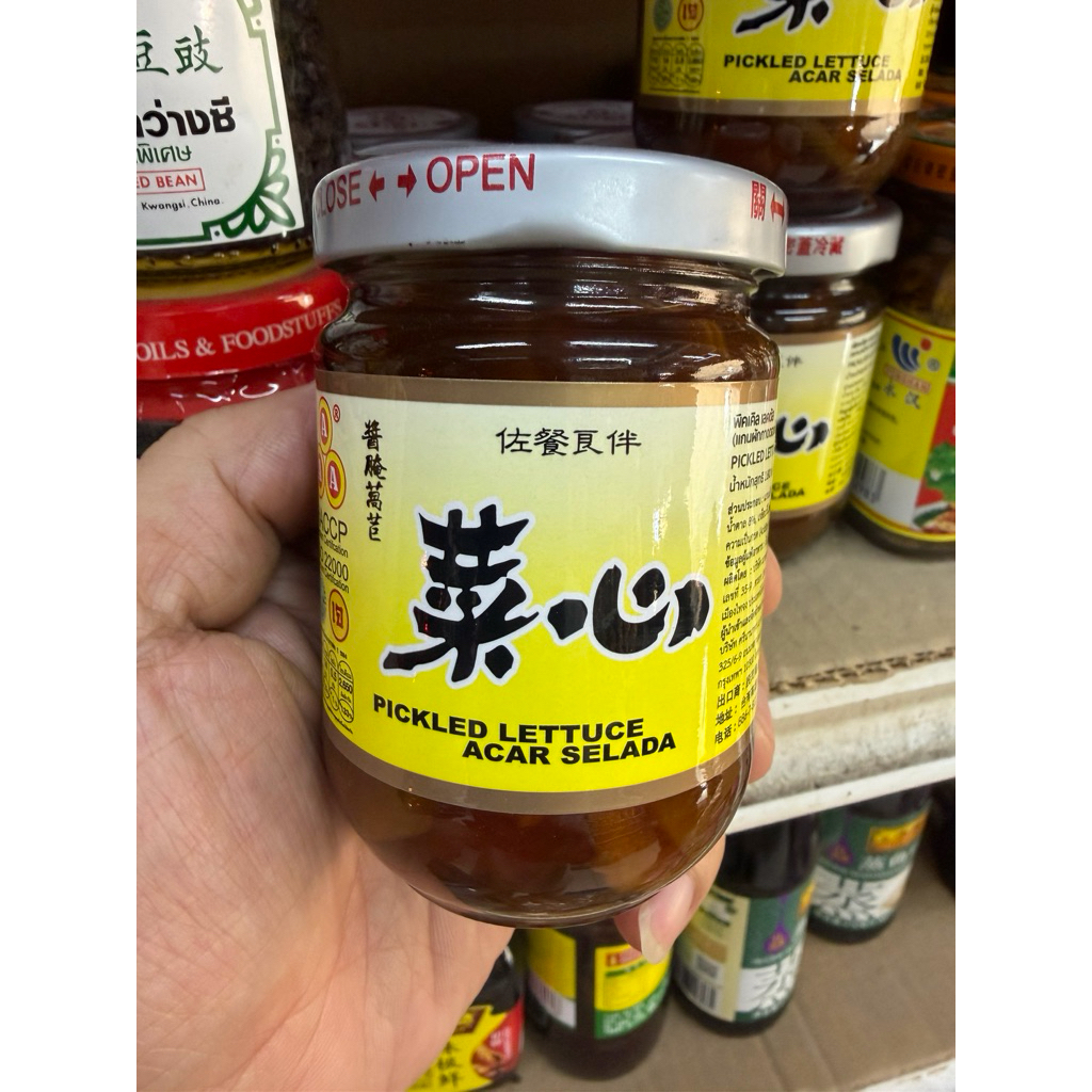 แกนผักกาดดองในน้ำปรุงรส ตรา AAA 菜心(Pickled Lettuce) น้ำหนักสุทธิ 180 กรัม