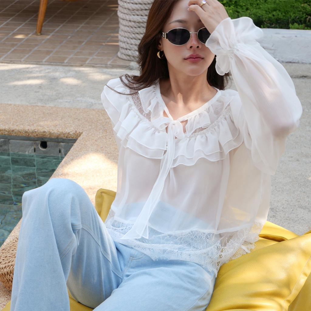 LUCA STUDIO_Phiora Blouse - เสื้อเบลาส์ ผ้าชีฟองเนื้อนิ่ม สีขาว ดีเทลแต่งรูดระบายเลเยอร์ช่วงรอบคอ