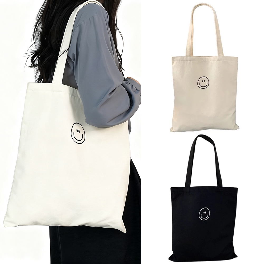 กระเป๋าผ้ามินิมอล กระเป๋าผ้าใบพร้อมใบหน้ายิ้มแย้ม 34*38CM สไตล์เกาหลีมินิมอล มีให้เลือกทั้งสีดำและสีขาว