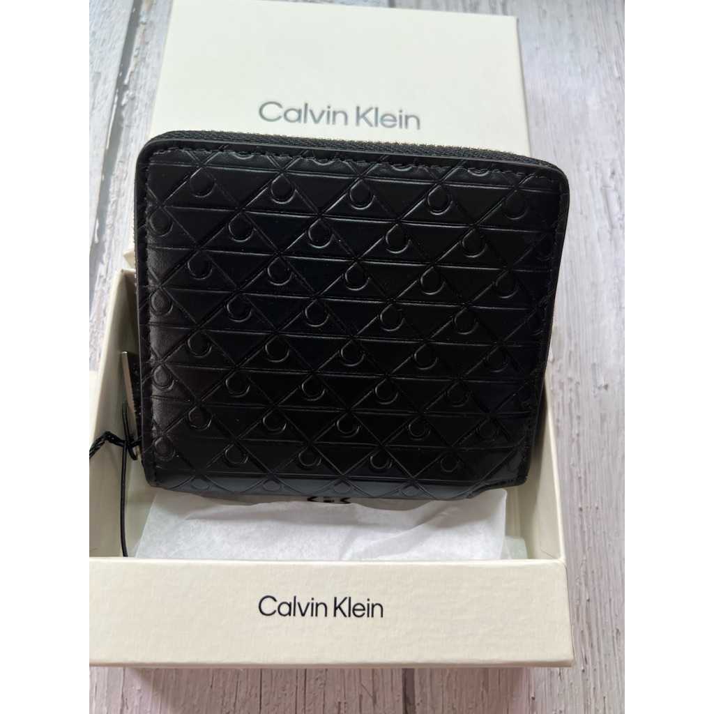 CK Embossed Allover Emblem Logo Zip Wallet leather