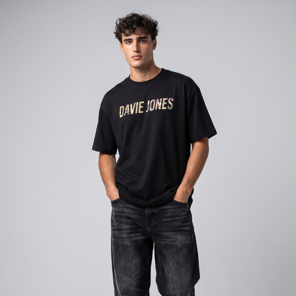 DAVIE JONES تيشيرت رجالي واسع بالشعار