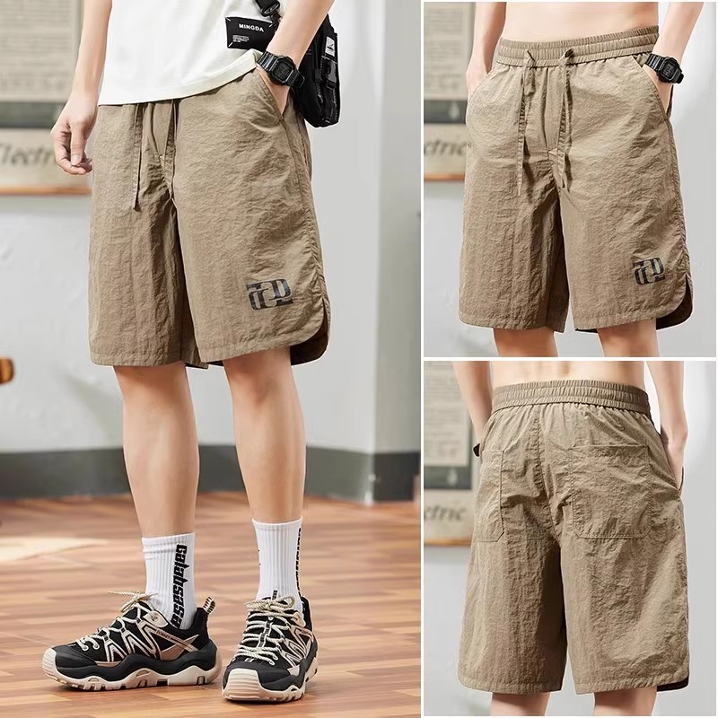 🩳กางเกงขาสั้น🩳กางเกงกีฬาขาสั้นผู้ชาย แห้งเร็วพิเศษ ลำลอง ไซส์หลวมพลัสไซส์ เอวยางยืด ผ้าเย็น 4 สี - รูปที่ 7