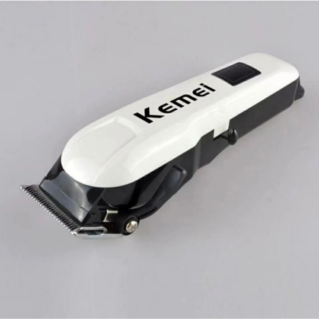 Kemei km809A ปัตตาเลี่ยนตัดผม ไร้สาย ใช้งานสะดวก แถมหวีลองที่ชาร์จในตัว ของแท้