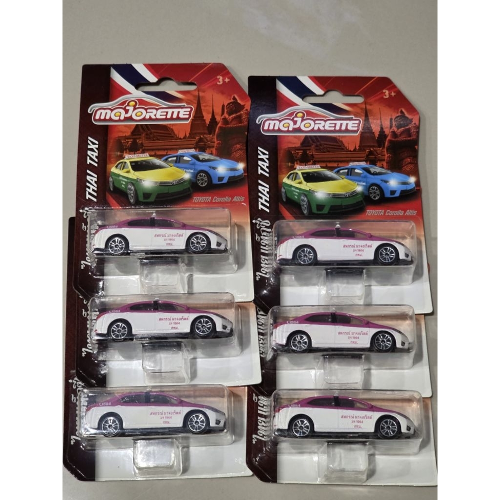 โมเดลรถเหล็ก Majorette Taxi สีขาวชมพู ขนาดยาวประมาณ 7.5cm
