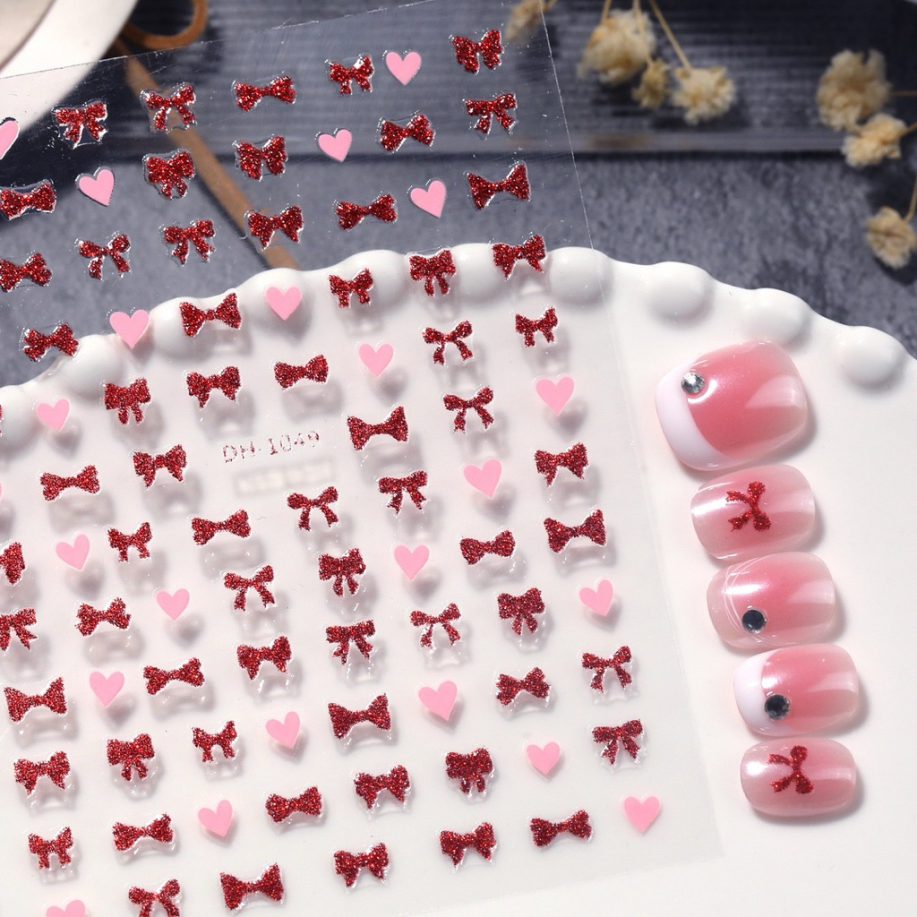 สติกเกอร์ติดเล็บ 3D ลายหัวใจ โบว์ โทนสีชมพูสดใส แผ่นละ 9 บาท