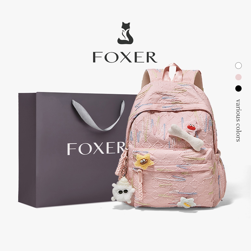 FOXER กระเป๋าเป้ดีไซน์ปักเส้นหลายสี มีจี้น่ารัก ความจุใหญ่ ใช้เรียนและออกไปข้างนอก