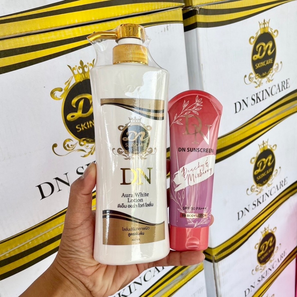 (โลชั่นDN 1 แถมกันแดด DN1) DN Aura White Lotion ดีเอ็น ออร่า ไวท์ โลชั่น (ขวดขาวหัวปั้มสีทอง )