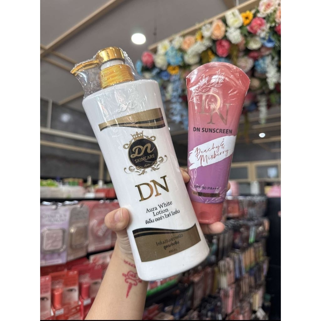 ซื้อ ครีม1 แถม กันแดด1💜DN Aura​ White​ Lotion ดีเอ็น ออร่าไวท์