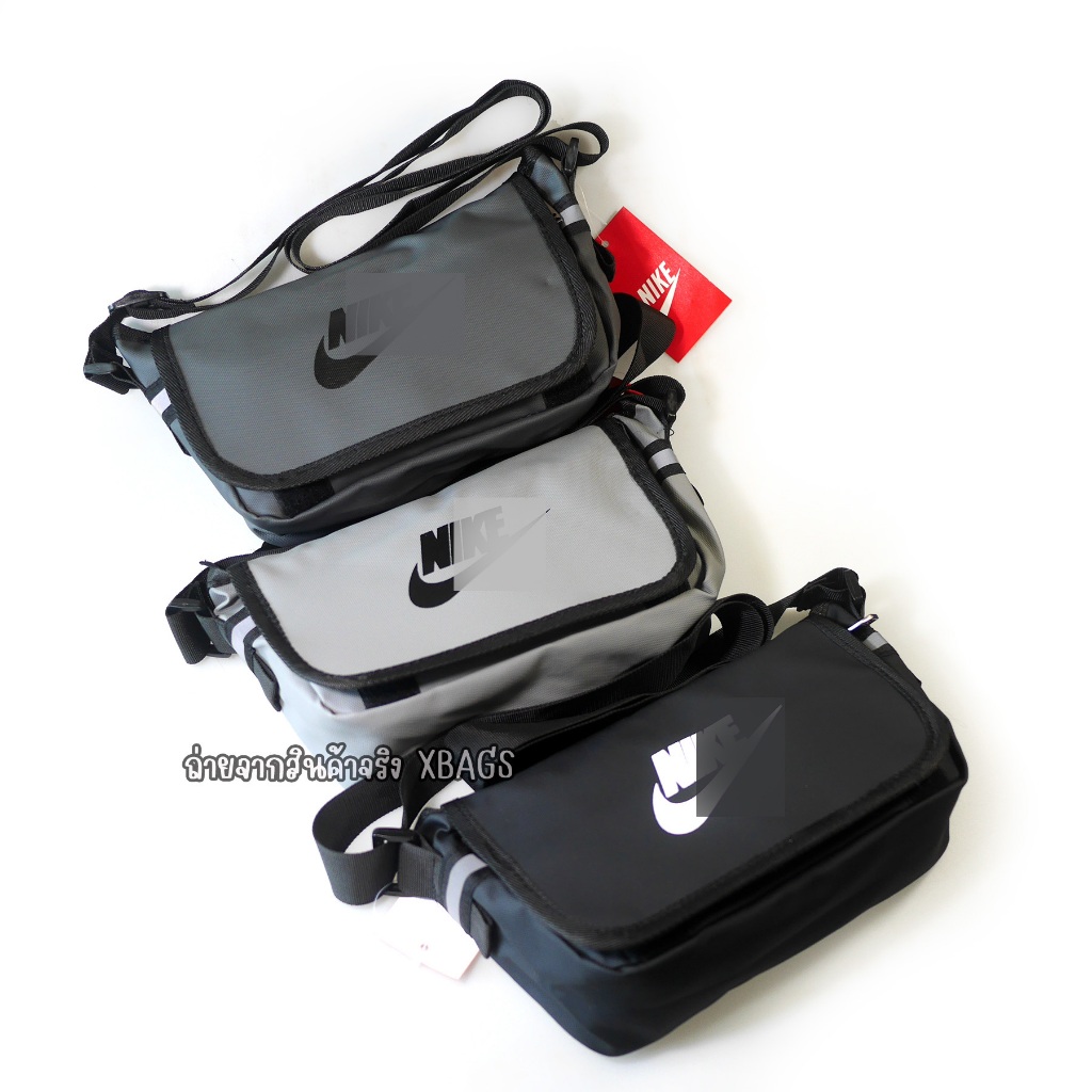 สะพายข้าง N/K ทรงคล้าย messenger ขนาด 26 ซม. มีฝาปิด ผ้าเคลือบกันน้ำ สายสะพายยาวมาก