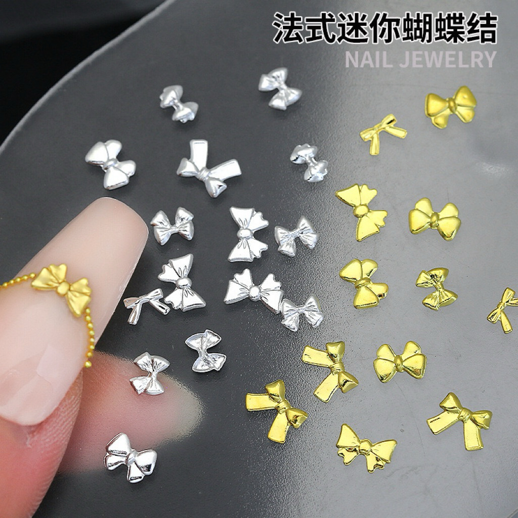 อะไหล่โบว์สีเงินสีทองแบบบาง สำหรับแต่งเล็บ (20ชิ้น ต่อแพ็ค)