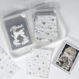 พร้อมส่ง💫ถุงฝากาวแพคการ์ด 50ชิ้น ลายผูกโบว์ ดาว ใส่โฟโต้การ์ด สินค้า สวยมาก ขนาด8*10cm