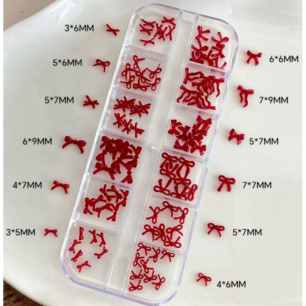 เรซิ่นโบว์แดงคละแบบสำหรับแต่งเล็บ12ช่อง  ￼