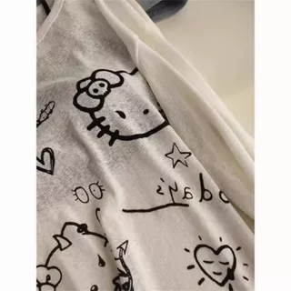 เสื้อยืดแขนยาวเปิดไหล่ลายคิตตี้สำหรับผู้หญิง เหมาะสำหรับฤดูใบไม้ผลิ ฤดูใบไม้ร่วง และฤดูร้อน ดีไซน์โดดเด่น ทรงหลวม ช่วยให
