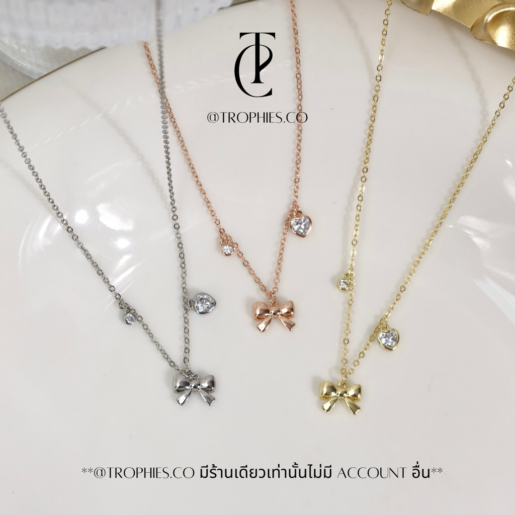 TROPHIES.CO - Baby ribbon necklace สร้อยคอโบว์ หัวใจ เพชร