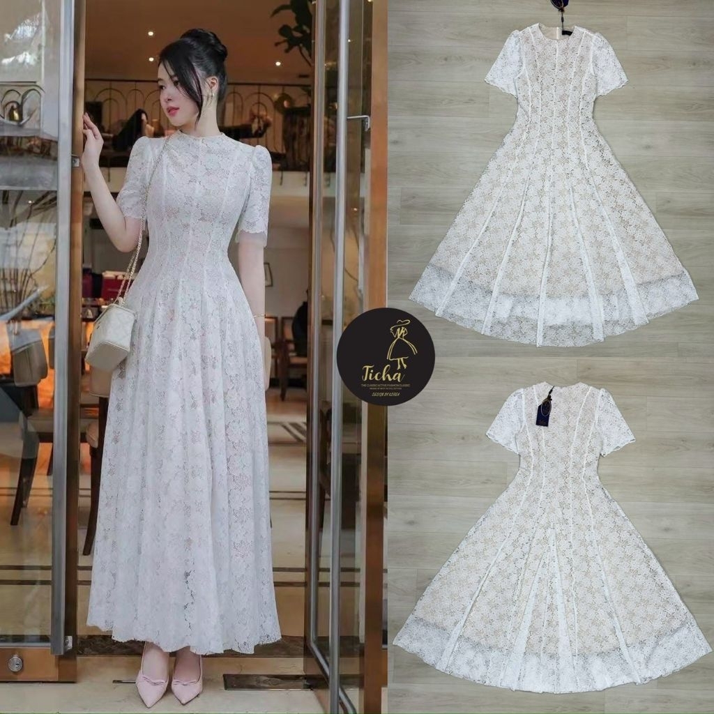 Ticha Maxi เดรสลูกไม้สีขาว แขนสั้น คอกลม ช่วงอก เอวเข้ารูป ตัวกระโปรงแต่งบานออก ปลายชายแต่งพริ้วๆให้ทรงสวย