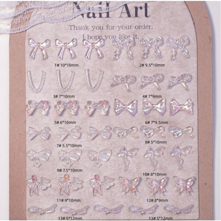 [ถุงละ 20 ชิ้น]โบว์ตกแต่งเล็บ โบว์เรซิ่น โบว์ใส งานวิบวับสวยงามมาก โบว์ ผีเสื้อ โค้ง ดอกไม้ พร้อมส่ง