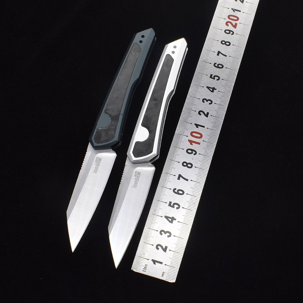Kershaw 7050 มีดพับ จัดการ: อลูมิเนียม + คาร์บอนไฟเบอร์ ขอบตัด: D2 ความแข็ง: 58-59HRC