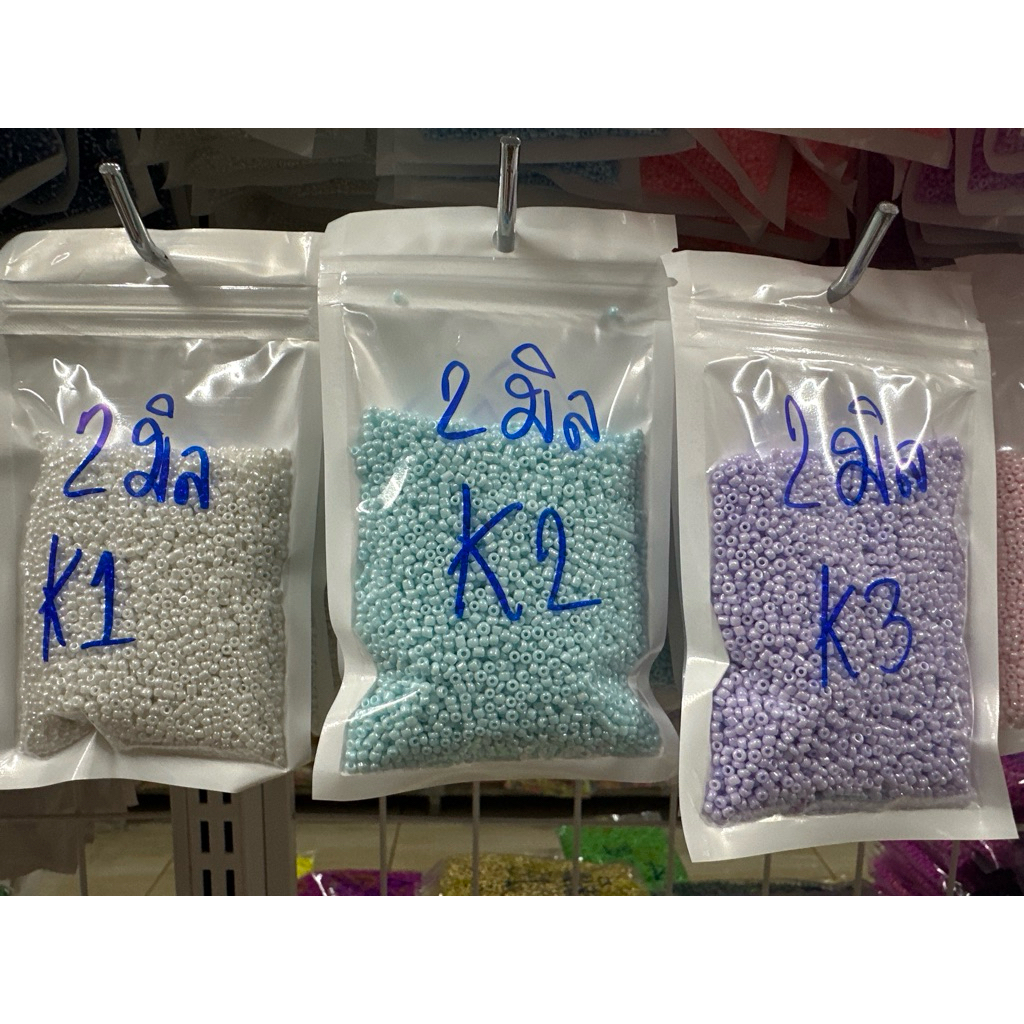 ลูกปัดเม็ดทรายขนาด2สีพาสเทลKมิลถุง70กรัม