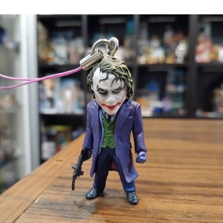 the JOKER figure strap