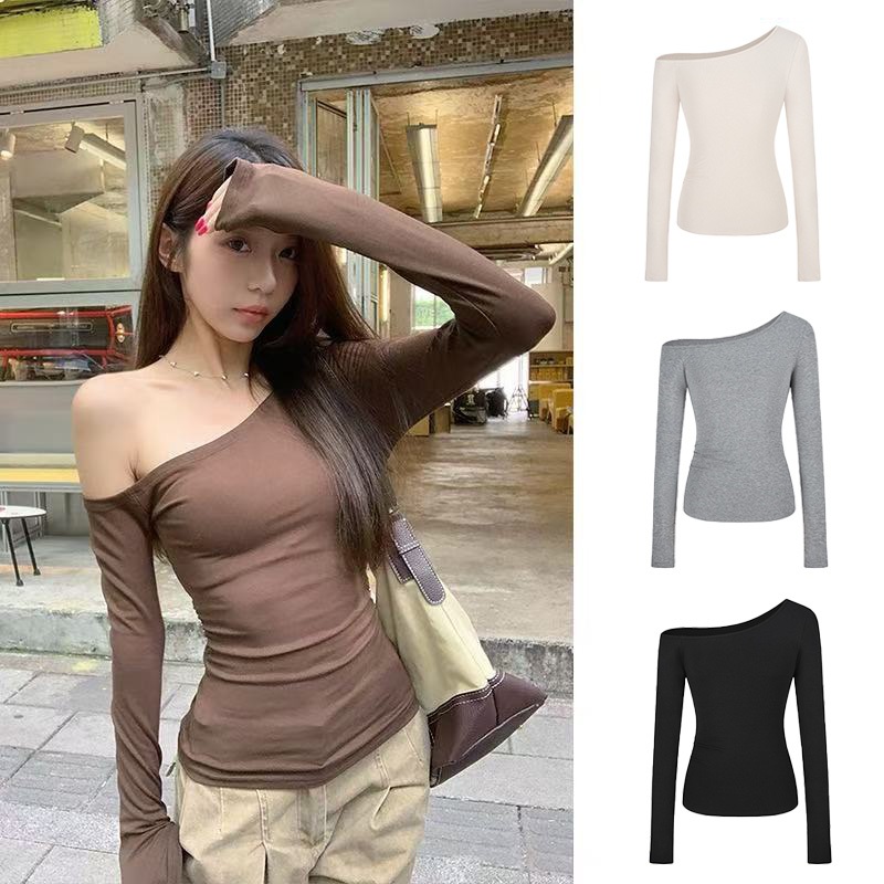 เสื้อยืดแขนยาวผู้หญิงแฟชั่น ใหม่ ครอบตัดด้านบน เสื้อปาดไหล่สีดำเซ็กซี่ ไหล่ลาดเอียง สไตล์ยุโรปและอเมริกา ทรงเข้ารูป