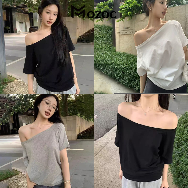 MOZOC สุภาพสตรีออกแบบความรู้สึกหนึ่งคำคอเอียงไหล่แขนสั้นหลวม ผ่อนปรน ลมปิดไหล่แขนสั้น