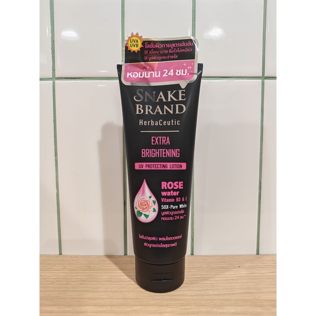 (Exp.2027)​โลชั่นตรางู Snake Brand Herbaceutic Extra Brightening UV Protecting Lotion 180 ml.