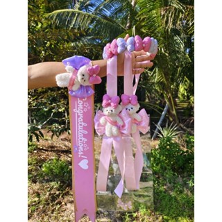 เซตมงกุฎสายสะพายพวงมาลัยธนบัตร10ใบโบว์ชมพูม่วง 3 ชิ้นของขวัญ…