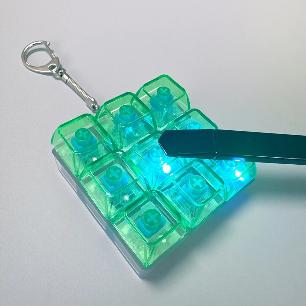 พวงกุญแจคีย์บอร์ดเรืองแสง 9 ปุ่ม LED Mini Keyboard Keychain ของเล่นไฟ LED thumbnail 7