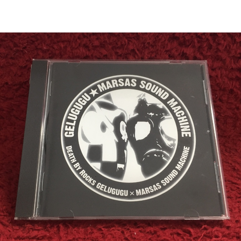 CD GELUGUGU MARSAS  SOUND MACHINE - Death by Rocks GELUGUGU×MARSAS SOUND MACHINE สภาพตามปก CA49-18