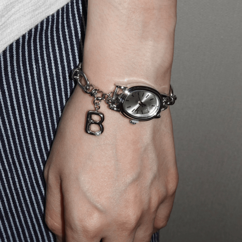 Beaming.bkk - Oval Watch with Alphabet Charm Bracelet (สินค้ามาพร้อมกล่องใส่เครื่องประดับ)