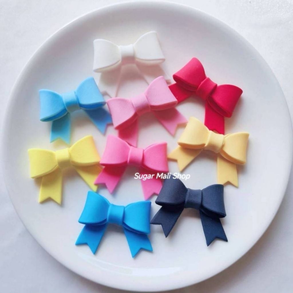 🎀กัมเพสรูปโบว์🎀 ขนาด5.5cm(ราคาต่อ1ชิ้น)  น้ำตาลกัมเพสตกแต่งเค้กรูปโบว์ มีให้เลือกหลายสีนะคะ กลิ่นหอมหวานน้อย ทานได้นะคะ
