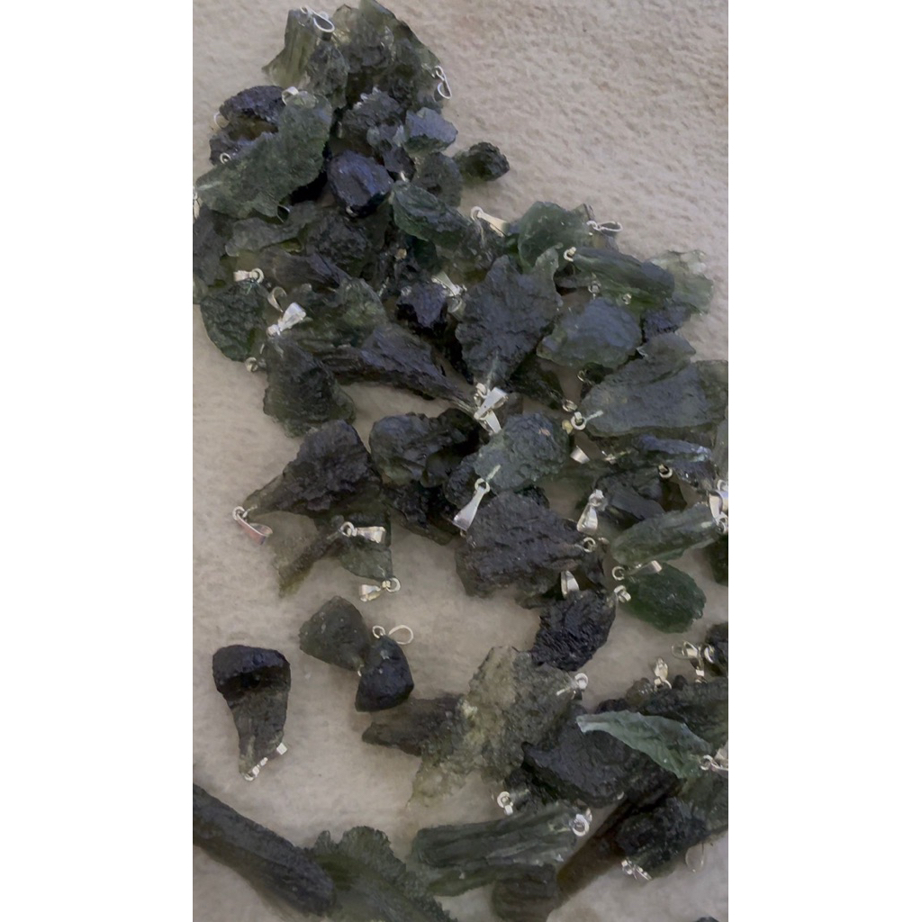 beautiful natural moldavite with silver pendant