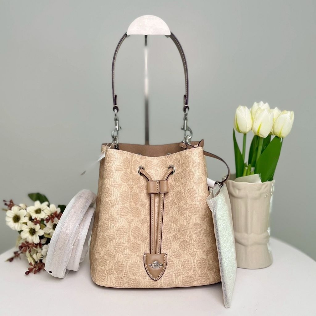 กระเป๋าสะพายไหล่ COACH  ROWAN BUCKET BAG IN SIGNATURE CANVAS CBH07