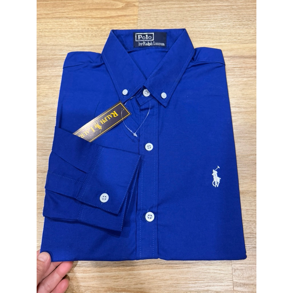 สินค้าใหม่ไม่มีรีวิว✅PoLo เสื้อเชิ้ตแขนยาวสีน้ำเงินสดสามารถใส่ได้ชายและหญิงเนื้อผ้า Oxford สีไม่ตก