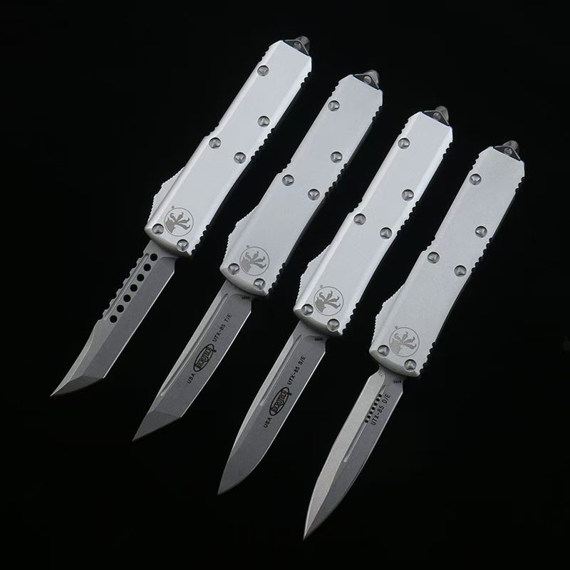Microtech UTx85 กระโดดตรง OTF วัสดุตัดขอบ: D2 วัสดุก้าน: อลูมิเนียมอัลลอยด์ ความแข็ง: 59HRC