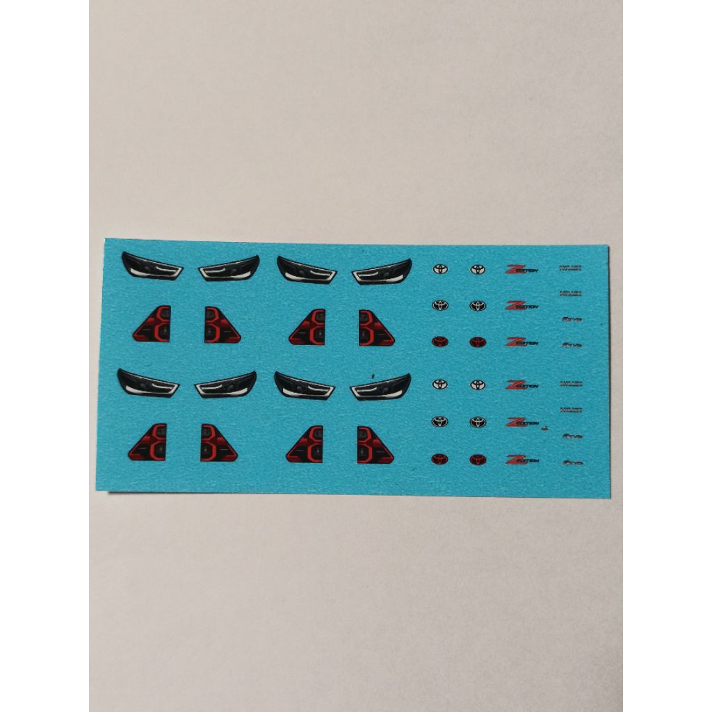 ดีคอลน้ำ Decal 1/64 ไฟหน้าไฟท้าย+โลโก้ Toyota Revo Zedition 2025 by Powing