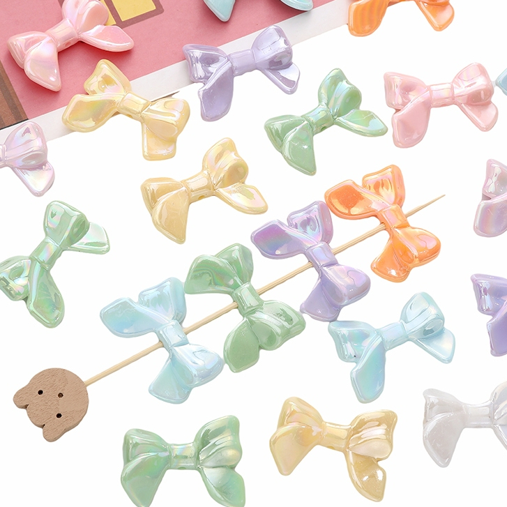ลูกปัดโบว์ริบบิ้นครีมสีขนมหวาน 32x24mm สำหรับ DIY งานเครื่องประดับทำจี้ สร้อยข้อมือ และสร้อยคอ