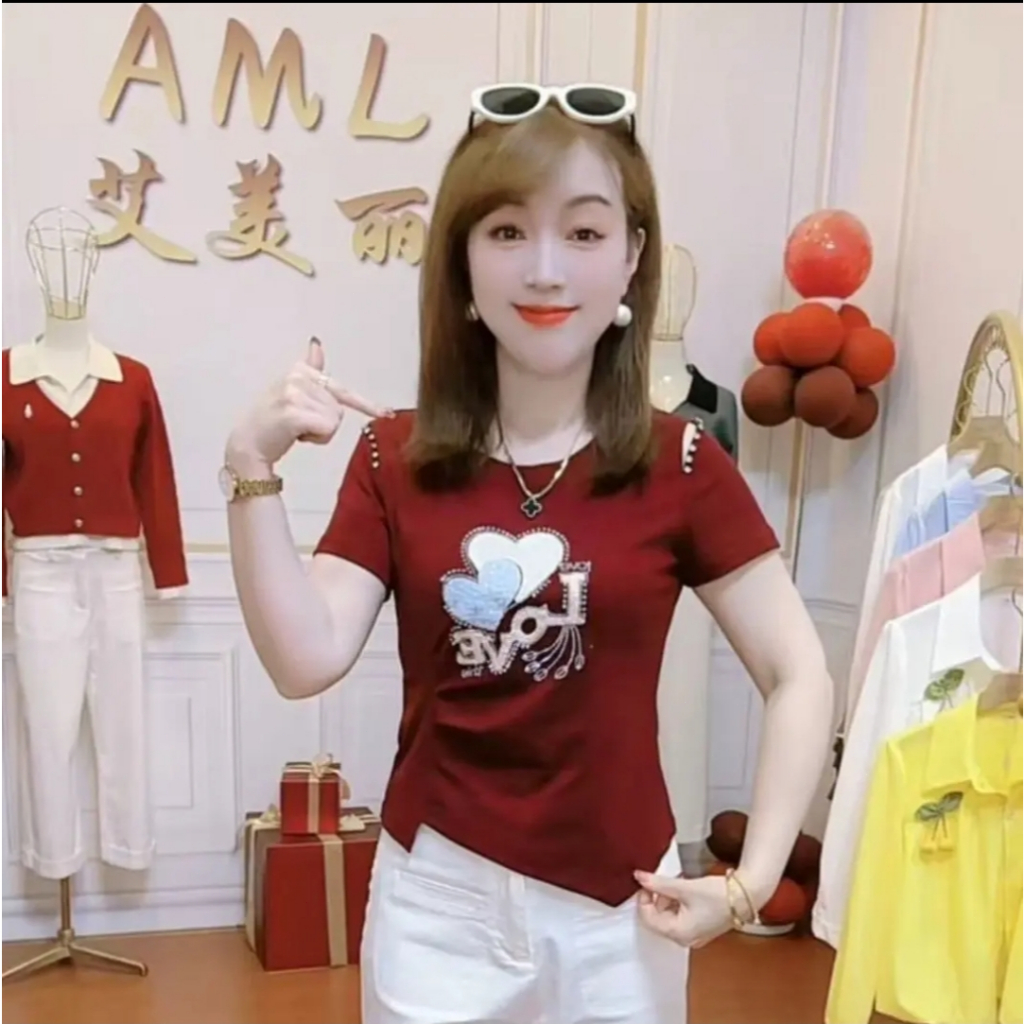 เสื้อยืดฤดูร้อนดีไซน์ใหม่ รูปหัวใจ ดีไซน์ทันสมัย ​​ทรงหลวม ใส่แล้วดูดี ช่วยให้ดูผอมเพรียวและอ่อนเยาว์