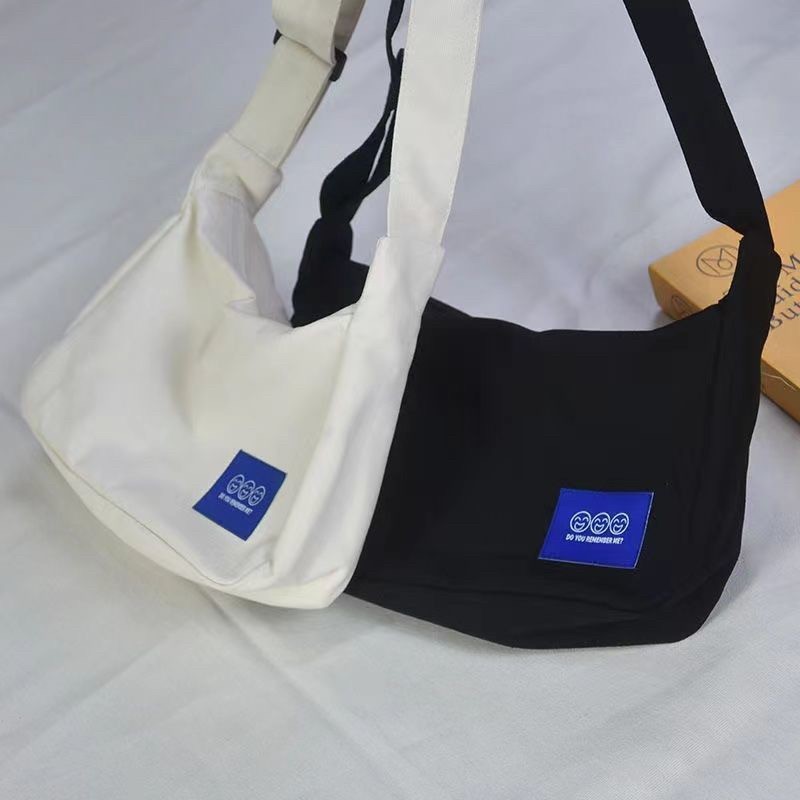 AMIKABAG(MK1913) กระเป๋าผ้าแคนวาสใบเล็ก-ป้ายงานสกีน