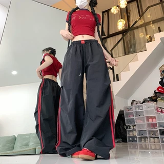 กางเกงขากว้างลายทางสีตัดกันสไตล์ย้อนยุคแบบอเมริกันสำหรับผู้หญิงในช่วงฤดูร้อนใหม่กางเกงขากว้างหลวมเอวยางยืดเชือกผูก