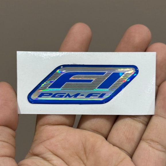 โลโก้ เรซิ่น PGM-FI ขนาด 2.3 x 6.5 cm. ติดรถมอเตอร์ไซค์ ระบบหัวฉีดอัจฉริยะของ HONDA