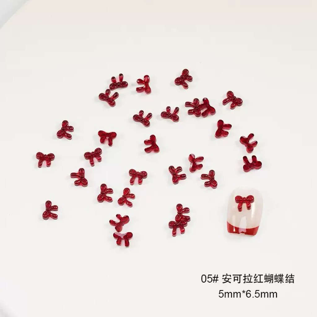อะไหล่โบว์แดงตะมุตะมิ ติดเล็บน่ารักแบ๊วๆ อะไหล่ DIY (50ชิ้น/ห่อ) สินค้าพร้อมส่ง