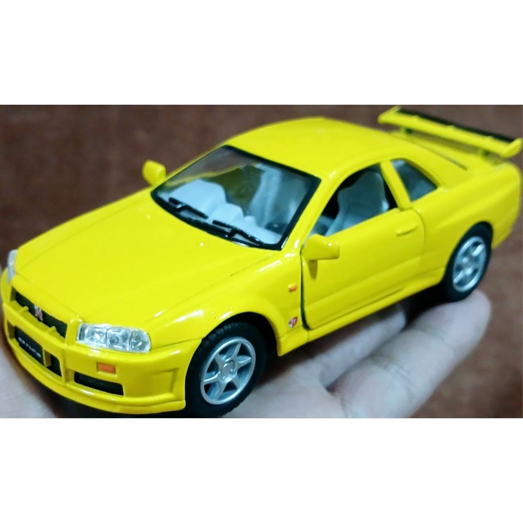โมเดลรถเหล็ก Nissan Skyline GTR R34 คันใหญ่ ของแท้ สภาพดี ขนาด 1/36 เปิดประตูได้ ลานปกติถอยหลังวิ่ง 