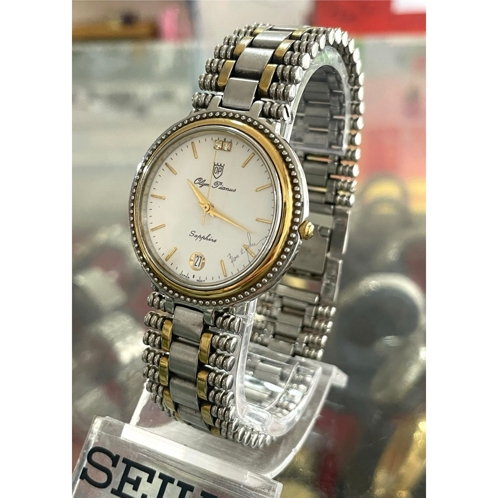 vintage Olym Pianus (OP) with quartz watch