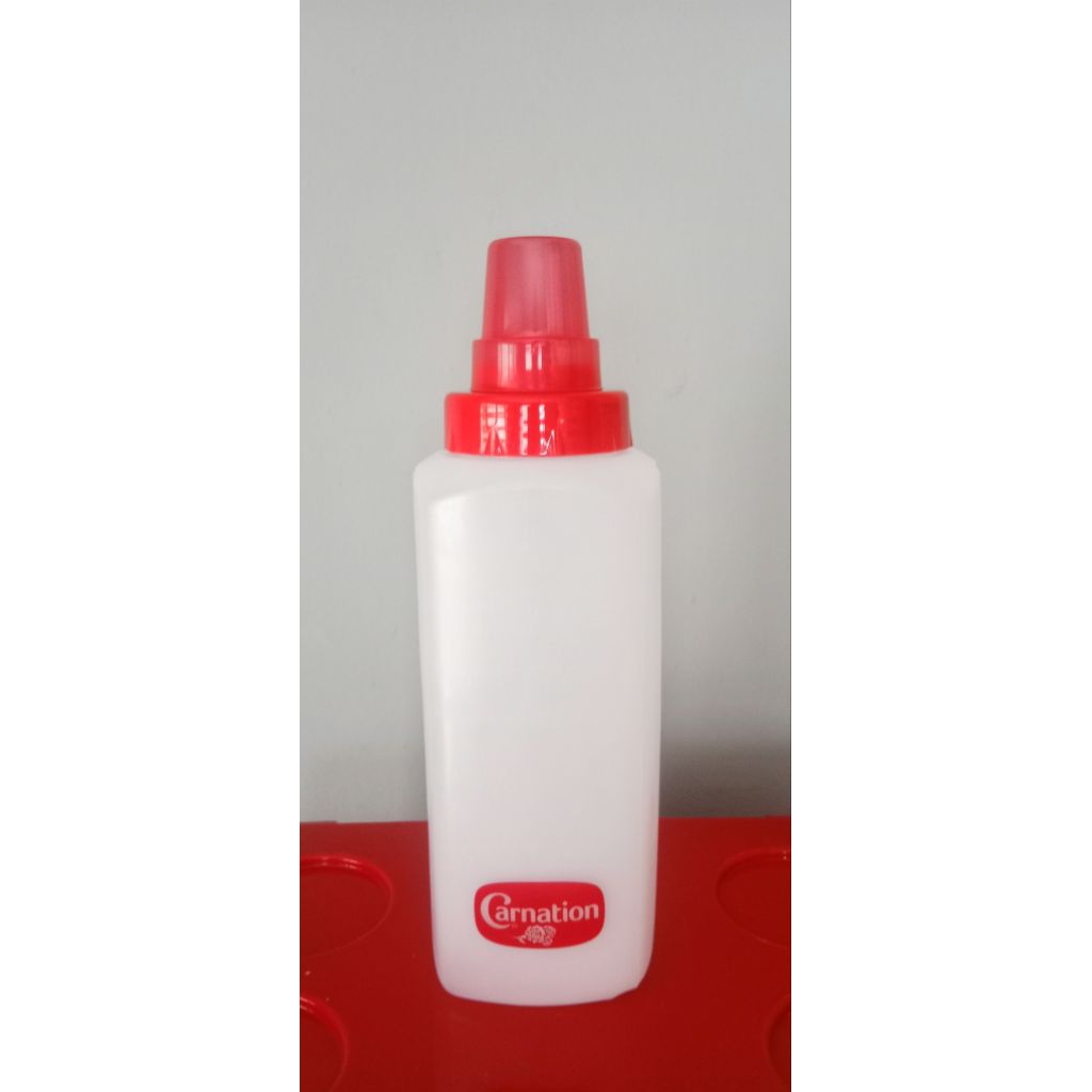 ขวดบีบคาร์เนชั่น ขนาด 1200 ml ขวดบีบนม ขวดบีบน้ำจิ้ม ขวดบีบซอส ขวดบีบ รุ่นมีสเกล กว้าง 9 cm สูง 27 cm พลาสติก Food Grade