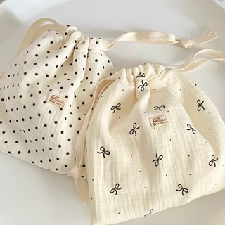 กระเป๋าผ้าลายจุด สีครีมลายจุดดำ โบว์ ผ้านุ่ม ใส่ของใช้จุกจิก รุ่น pokaldot flure.bags