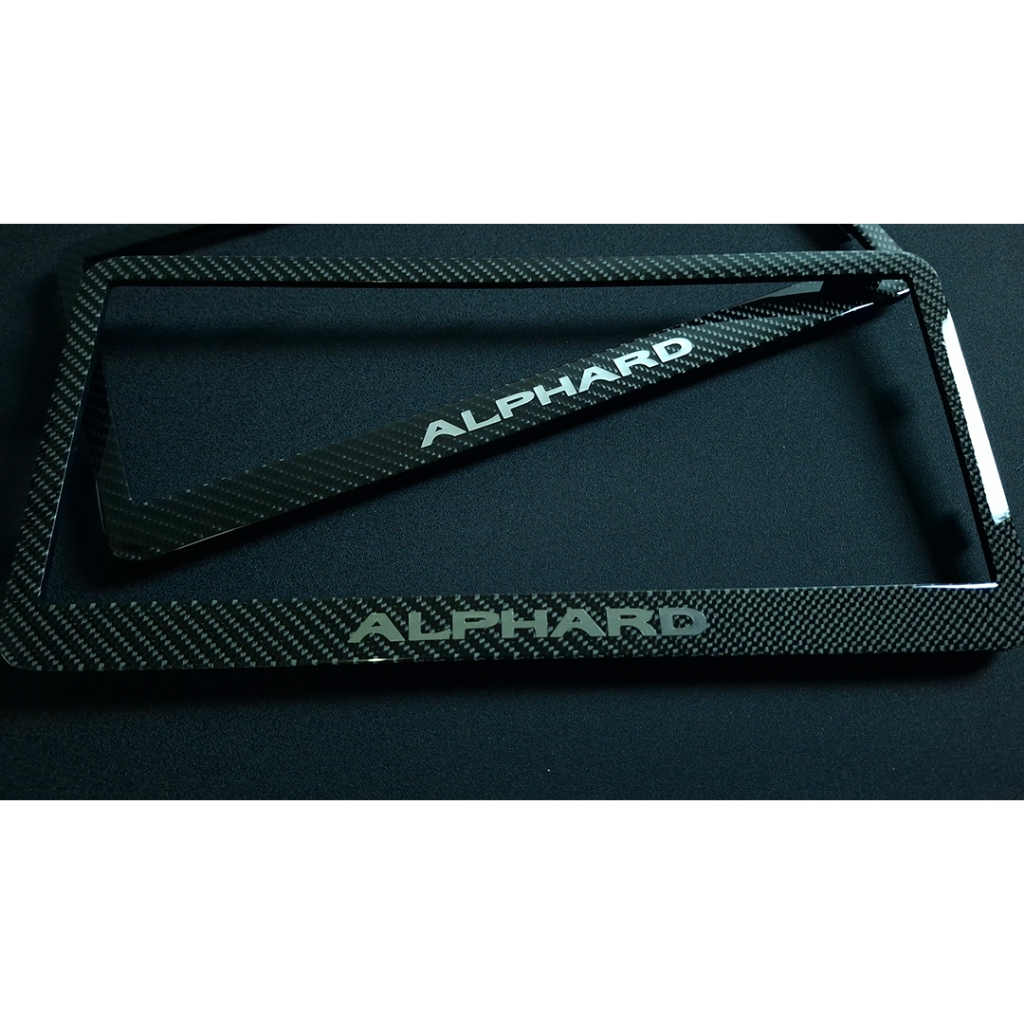 กรอบป้ายทะเบียน รถตู้ Alphard หุ้มคาร์บอนแท้ ลาย2 จำนวน1คู่ ราคา ถูกที่สุด ดีลบีเคเค